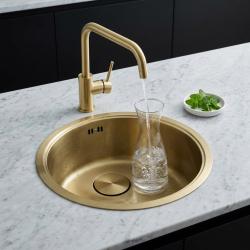 brass-kitchen-sink-with-water-carafe